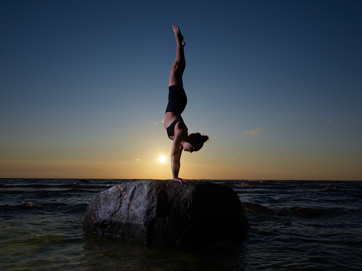 In this image: Iiris, one of our models from Joe McNally's Portrait Photography Workshop, captured by Gerhard Grossberger. The shooting location is Tuhkana Beach in Saaremaa.