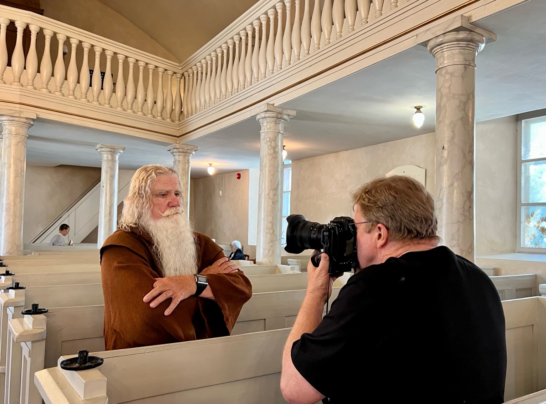 Photographer Joe McNally capturing Iivo, one of our models, in a church during Joe's portrait photography workshop in Saaremaa.