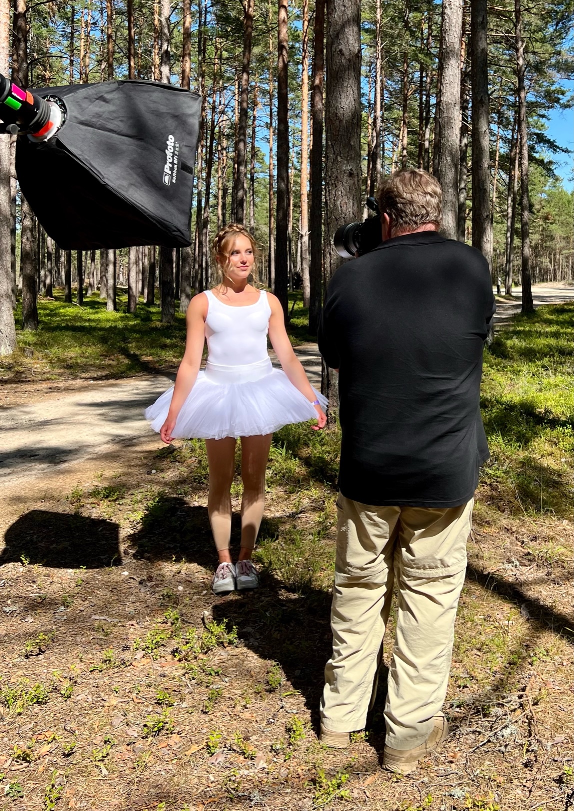 Photographer Joe McNally capturing Iiris, one of our models, in a beautiful forest in Saaremaa. Profoto provides high-end lighting equipment for the workshop.
